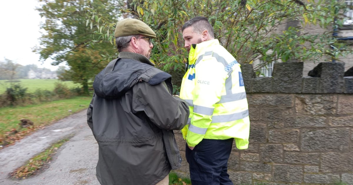 Flint and Denbigh Hunt member Ed Llloyd-Ellis talks with North Wales Police officer.