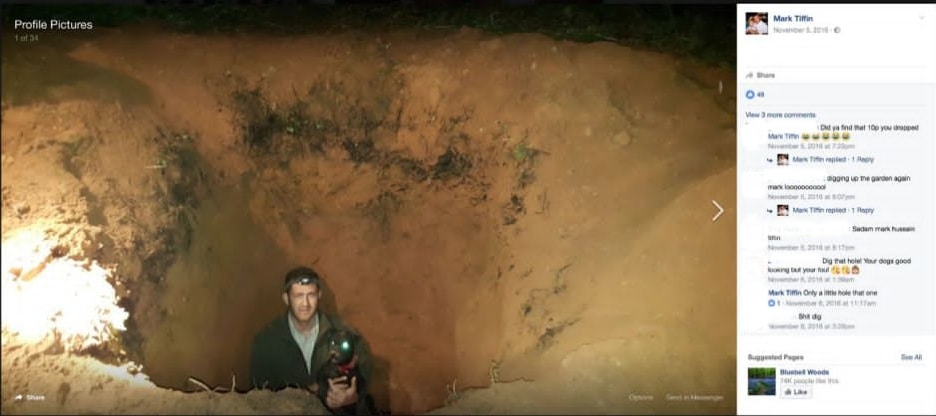 Mark Tiffin poses with a terrier down a freshly-dug hole. Screengrab via Facebook